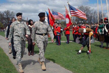 Army Maj. Gen. Joesph Carter (right), the adjutant general of the Massachusetts National Guard, Maj. David Hencke, the commander of the troops for the Military Muster (left), and Rep. John Tierney (rear left), and Salem Mayor Kimberley Driscoll (rear right), review the military units formed on the Salem Common in Salem, Mass., April 10, 2010. The celebration marked the 373rd anniversary of the First Muster.