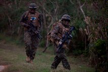 U.S. Marines with Company E, Battalion Landing Team, 2nd Battalion 4th Marines, 31st Marine Expeditionary Unit (MEU), patrol as they conduct a vertical assault during MEU Exercise (MEUEX), in Combat Town, Okinawa, Japan, Dec 10, 2014. BLT 2/4 is conducting training in preparation of their upcoming spring patrol. (U.S. Marine Corps photo by GySgt Ismael Pena/Released)