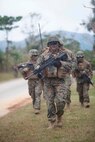 U.S. Marines with Company E, Battalion Landing Team, 2nd Battalion 4th Marines, 31st Marine Expeditionary Unit (MEU), conduct a patrol during a vertical assault as part of MEU Exercise (MEUEX), in Combat Town, Okinawa, Japan, Dec 10, 2014. BLT 2/4 is conducting training in preparation of their upcoming spring patrol. (U.S. Marine Corps photo by GySgt Ismael Pena/Released)