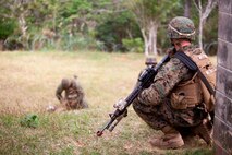 U.S. Marine with Company E, Battalion Landing Team, 2nd Battalion 4th Marines, 31st Marine Expeditionary Unit (MEU), provides security during a vertical assault as part of  the MEU Exercise (MEUEX), in Combat Town, Okinawa, Japan, Dec 10, 2014. BLT 2/4 is conducting training in preparation of their upcoming spring patrol. (U.S. Marine Corps photo by GySgt Ismael Pena/Released)