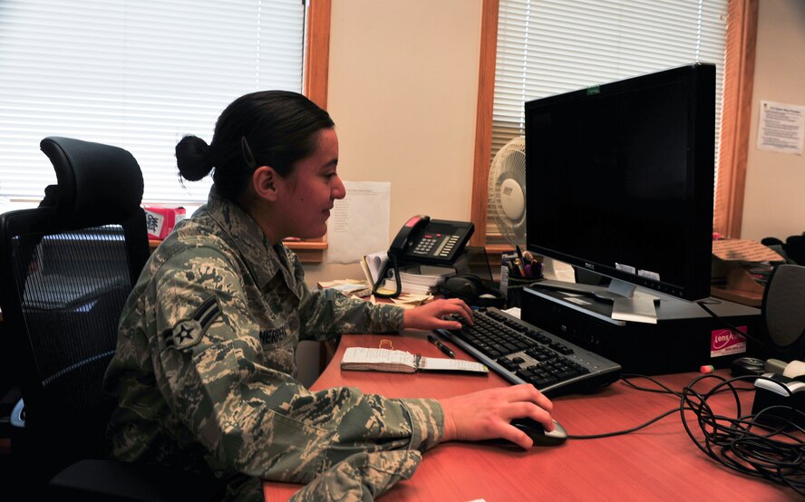 Airman 1st Class Nikki Herrera, 51st Communications Squadron client systems technician, prepares to add a computer to the network Dec. 18, 2014, on Osan Air Base, Republic of Korea. Herrera is this week's Airman Spotlight winner. (U.S. Air Force photo by Senior Airman David Owsianka)
