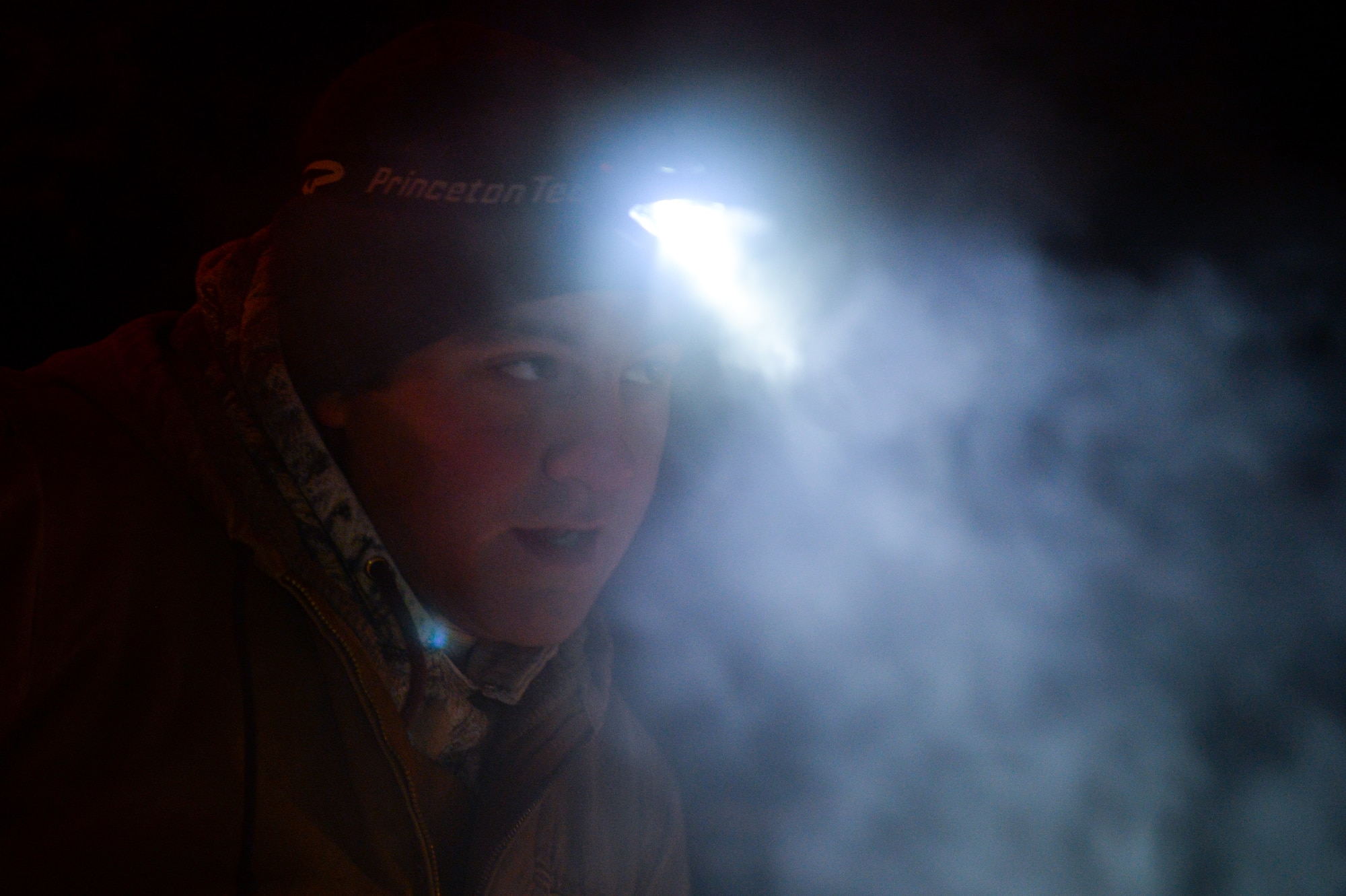 U.S. Air Force Senior Airman Tyler Dray, a range maintenance structures journeyman assigned to the 354th Civil Engineer Squadron, looks on while constructing an ice bridge in Fairbanks, Alaska, Nov. 20, 2014. The bridge must be constructed every other year to provide access to the $20 million range complex used to train pilots from around the world during RED FLAG-Alaska exercises.  (U.S. Air Force photo by Staff Sgt. Shawn Nickel/Released)
