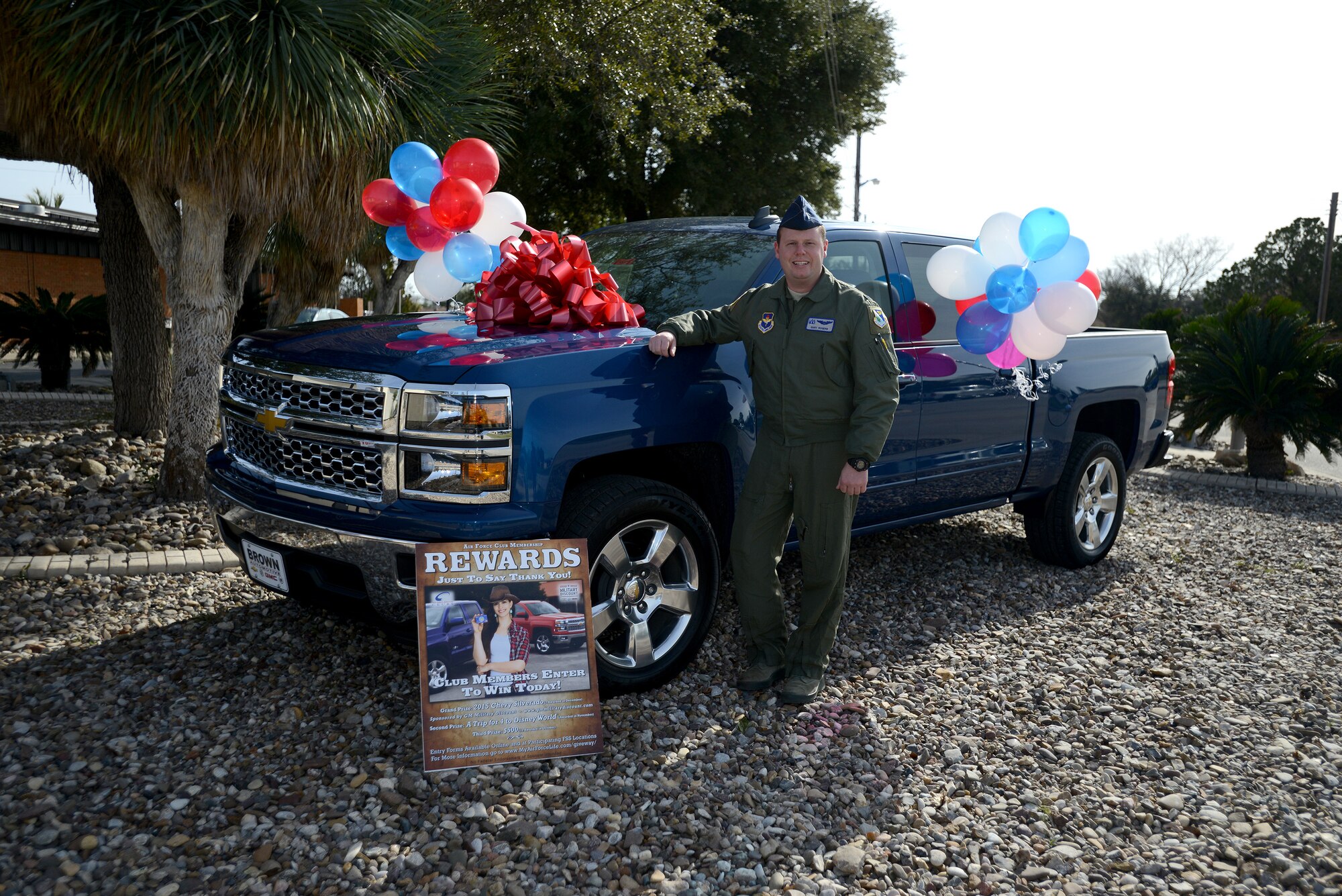 Second Lt. Gary Rogers, a newly graduated pilot from Laughlin’s pilot training program, poses next to a 2015 Chevy Silverado outside of Club XL on Laughlin Air Force Base, Texas, Jan. 5, 2015. Rogers won the vehicle in an Air Force Club prize drawing that occurred in December and he was notified of his win Jan. 5 during a commander’s call by Col. Brian Hastings, 47th Flying Training Wing commander.  (U.S. Air Force photo by Staff Sgt. Steven R. Doty) (Released)
