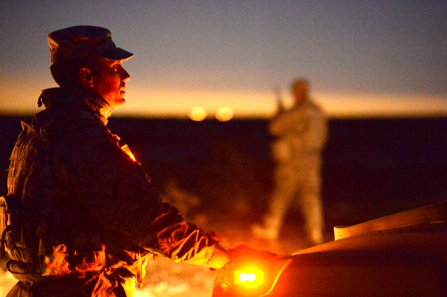 Senior Master Sgt. James Robbins, 99th Ground Combat Training Squadron operations superintendent oversees field training exercise operations during a Base Security Operations course at the Silver Flag Alpha Range Complex north of Las Vegas Dec. 18, 2014. This is the last BSO course that will take place at Silver Flag Alpha, as the 99th Ground Combat Training Squadron is projected to close in early 2015. All Air Force tactical security forces based training will be moved to the new Desert Defender Ground Combat Readiness Training Center at Fort Bliss, Texas. (U.S. Air Force photo by Tech. Sgt. Nadine Barclay/Released) 