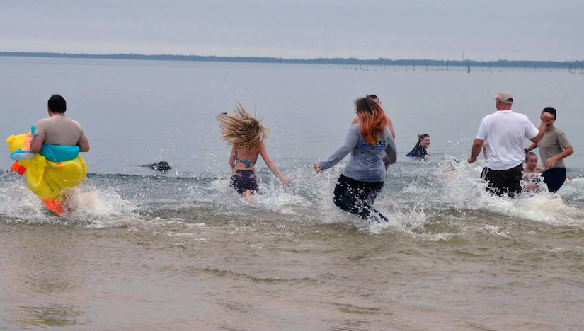 Nearly 20 people participated in the inaugural Polar Plunge at the Joint Base Charleston Short Stay Recreation Area, Jan. 3, 2014. Richard Hahn, Short Stay manager, said he hopes the event will grow larger each year with more people taking the plunge into Lake Moultrie. (U.S. Air Force photo/Jessica Donnelly)
