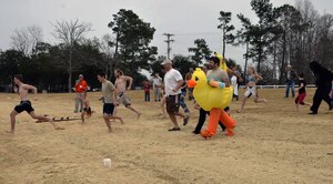 Polar Plunge participants race toward the chilly waters of Lake
Moultrie as part of the inaugural Polar Plunge at the Joint Base Charleston
Short Stay Recreation Area, Jan. 3, 2014. Nearly 20 people took the plunge while
others watched on as they enjoyed hot chocolate and hot dogs. (U.S. Air Force photo/Jessica Donnelly)
