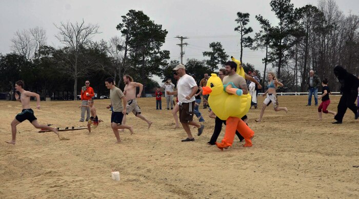 Polar Plunge participants race toward the chilly waters of Lake
Moultrie as part of the inaugural Polar Plunge at the Joint Base Charleston
Short Stay Recreation Area, Jan. 3, 2014. Nearly 20 people took the plunge while
others watched on as they enjoyed hot chocolate and hot dogs. (U.S. Air Force photo/Jessica Donnelly)
