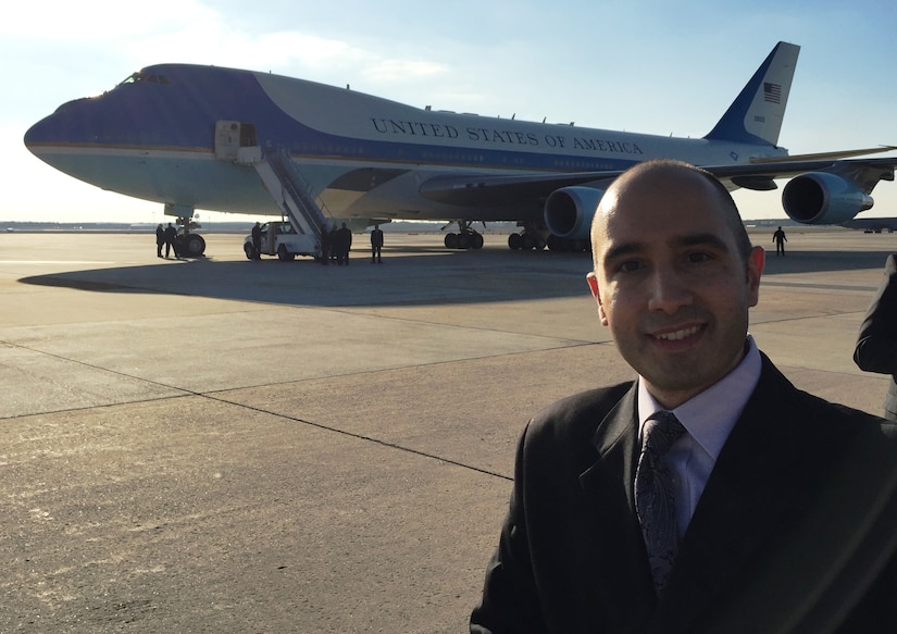 Anthony Quattrone, a security specialist for the Army Reserve's 99th Regional Support Command, stands near Air Force One after meeting President Barack Obama Dec. 15 at Joint Base McGuire-Dix-Lakehurst, N.J. Quattrone was chosen to be part of a select group that would meet the president during his visit to the Garden State. (U.S.Army photo by Staff Sgt. Shawn Morris/Released)