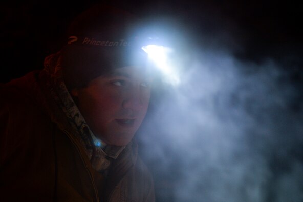 Senior Airman Tyler Dray looks on while constructing an ice bridge Nov. 20, 2014, in Fairbanks, Alaska. The bridge must be constructed every other year to provide access to the $20 million range complex used to train pilots from around the world during Red Flag-Alaska exercises. Dray is a range maintenance structures journeyman assigned to the 354th Civil Engineer Squadron on Eielson Air Force Base, Alaska. (U.S. Air Force photo/Staff Sgt. Shawn Nickel)