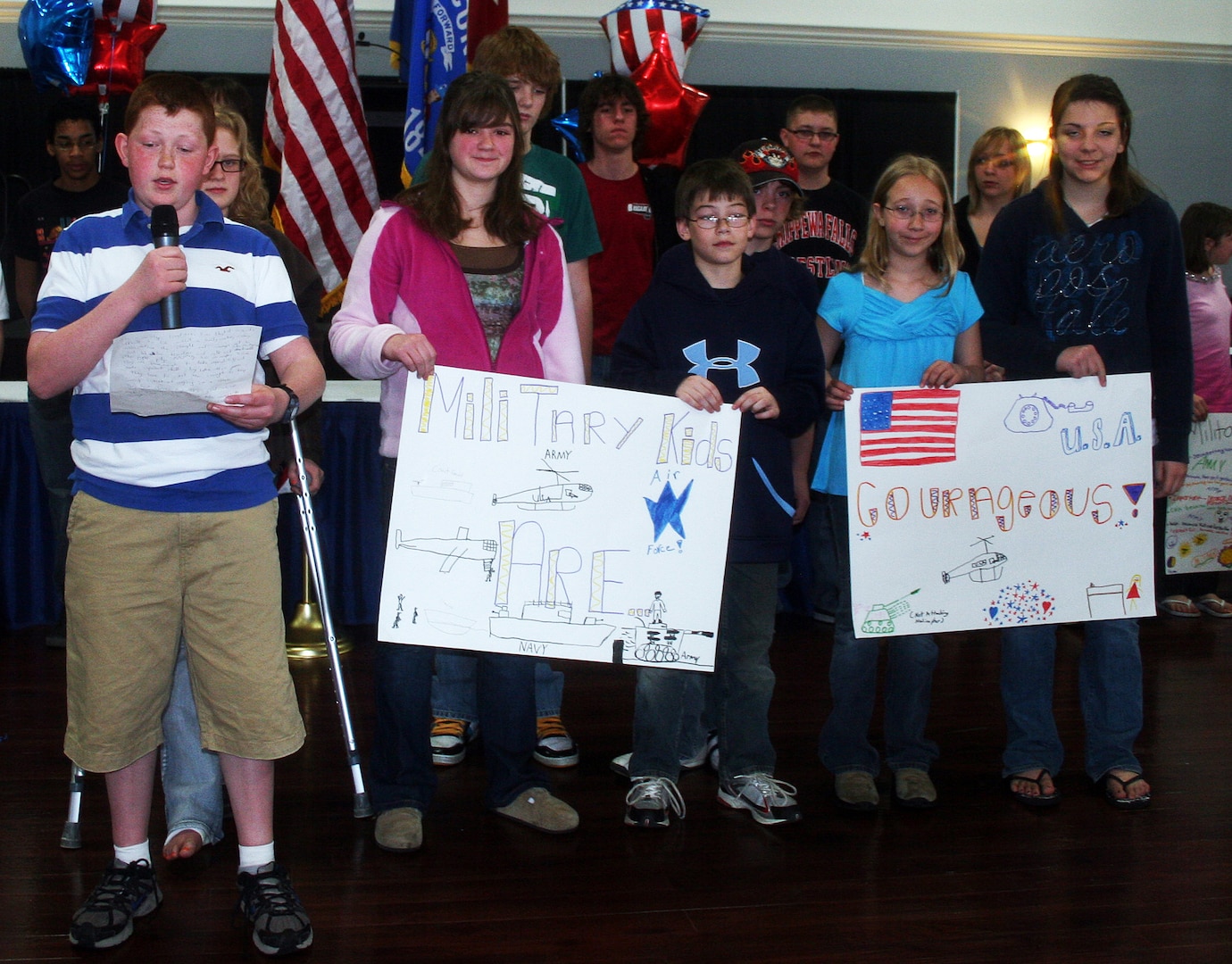 Charlie Pond, the son of a Wisconsin National Guard Soldier, reads an essay entitled "Military kids are courageous" during a youth symposium held during the recent Wisconsin National Guard Family Program statewide conference in Wausau
