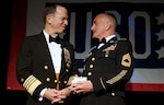 Adm. Mike Mullen, chairman of the Joint Chiefs of Staff congratulates U.S. Army MSgt. Robert Sutherland after presenting him with the Special Salute Award at the annual USO Gala at the Ritz Carlton in Arlington, Va., on April 14, 2010.