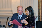 Air Force Gen. Craig McKinley, the chief of the National Guard Bureau, recognizes Valerie Gonzalez as a 2010 Our Military Kid of the Year at a ceremony at the Cannon House Office Building in Washington, D.C., on April 13, 2010. The daughter or a deployed servicemember, Valerie received a grant from Our Military Kids that paid for extracurricular activities while her father was overseas and she created an "Adopt a Soldier" program at her school that collected boxes of items to be sent to troops serving abroad. Our Military Kids has helped more than 17,000 children of National Guard and Reserve servicemembers with grants for enrichment activities and tutoring that nurture and sustain the children during the time a parent is away in service to our country.