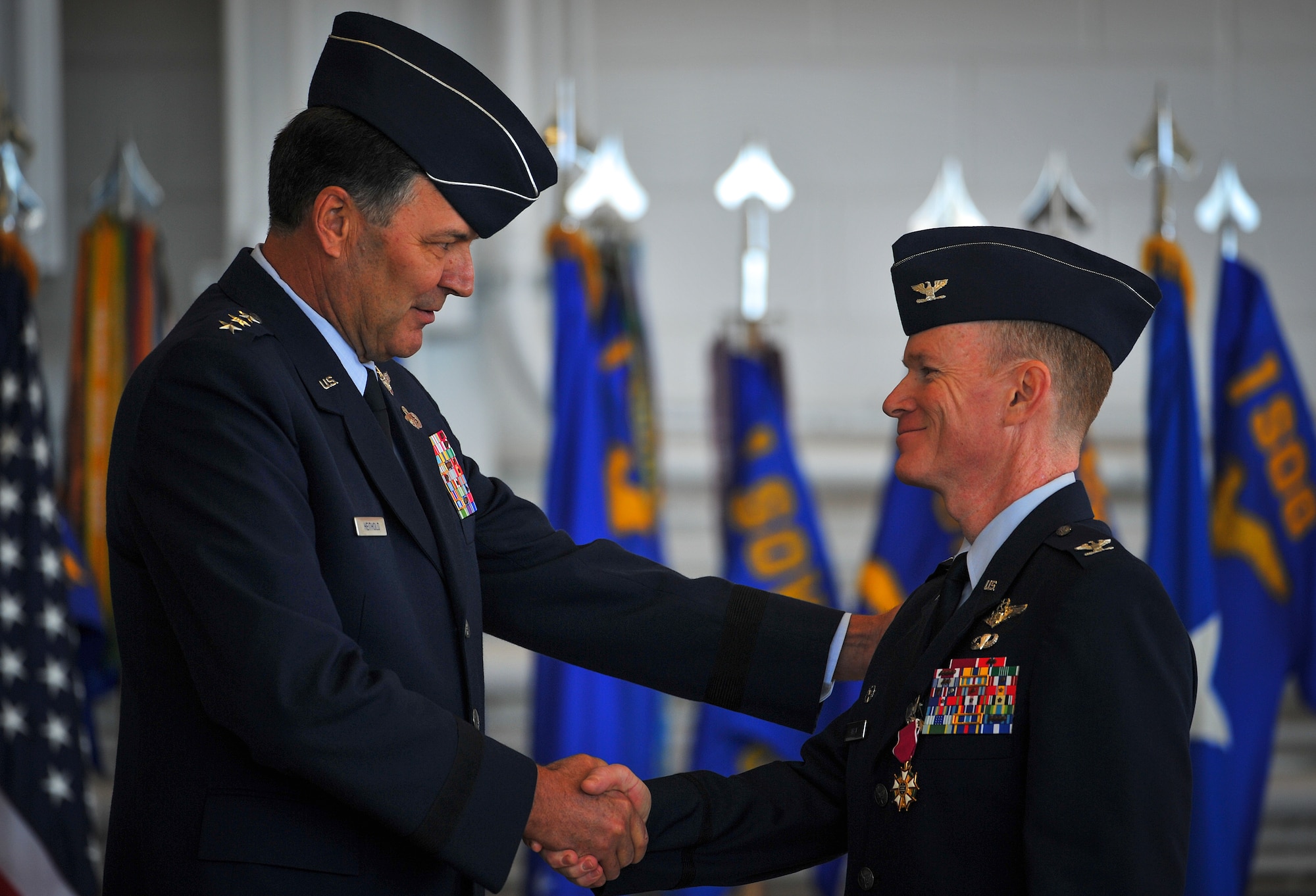 Lt. Gen. Bradley Heithold, Air Force Special Operations Command commander and Col. Bill West, shake hands during a change of command ceremony on Hurlburt Field, Fla., Jan. 6, 2014. Col. West relinquished command to Col. Sean Farrell who will assume command of the 1st SOW. (U.S. Air Force photo/Senior Airman Christopher Callaway) 
