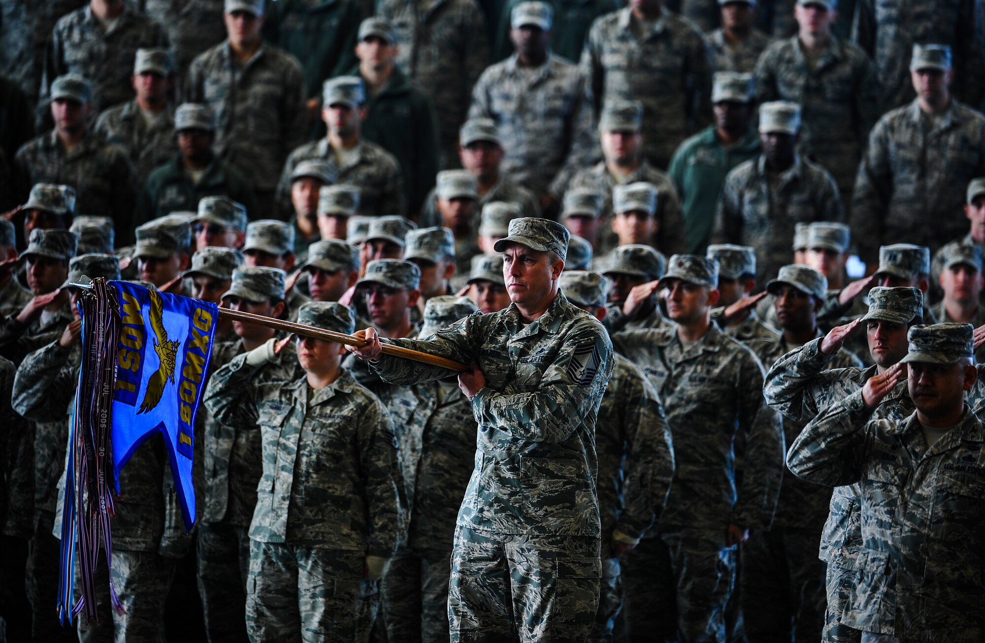 1st Special Operations Maintenance Group present arms during a wing change of command ceremony at the Freedom Hangar on Hurlburt Field, Fla., Jan. 6, 2015. Col. Sean Farrell assumed command of the 1st SOW during the ceremony. (U.S. Air Force photo/Senior Airman Christopher Callaway) 