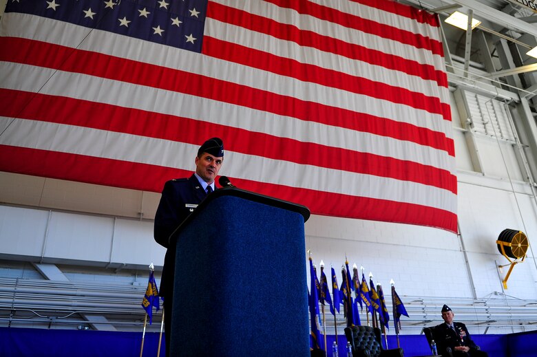 Col. Sean Farrell, 1st Special Operations Wing commander, assumes command during the 1st Special Operations Wing change of command ceremony at the Freedom Hangar on Hurlburt Field, Fla., Jan. 6, 2015. The primary mission of the 1st SOW is to rapidly plan and execute specialized and contingency operations in support of national priorities. (U.S. Air Force photo/Senior Airman Christopher Callaway)