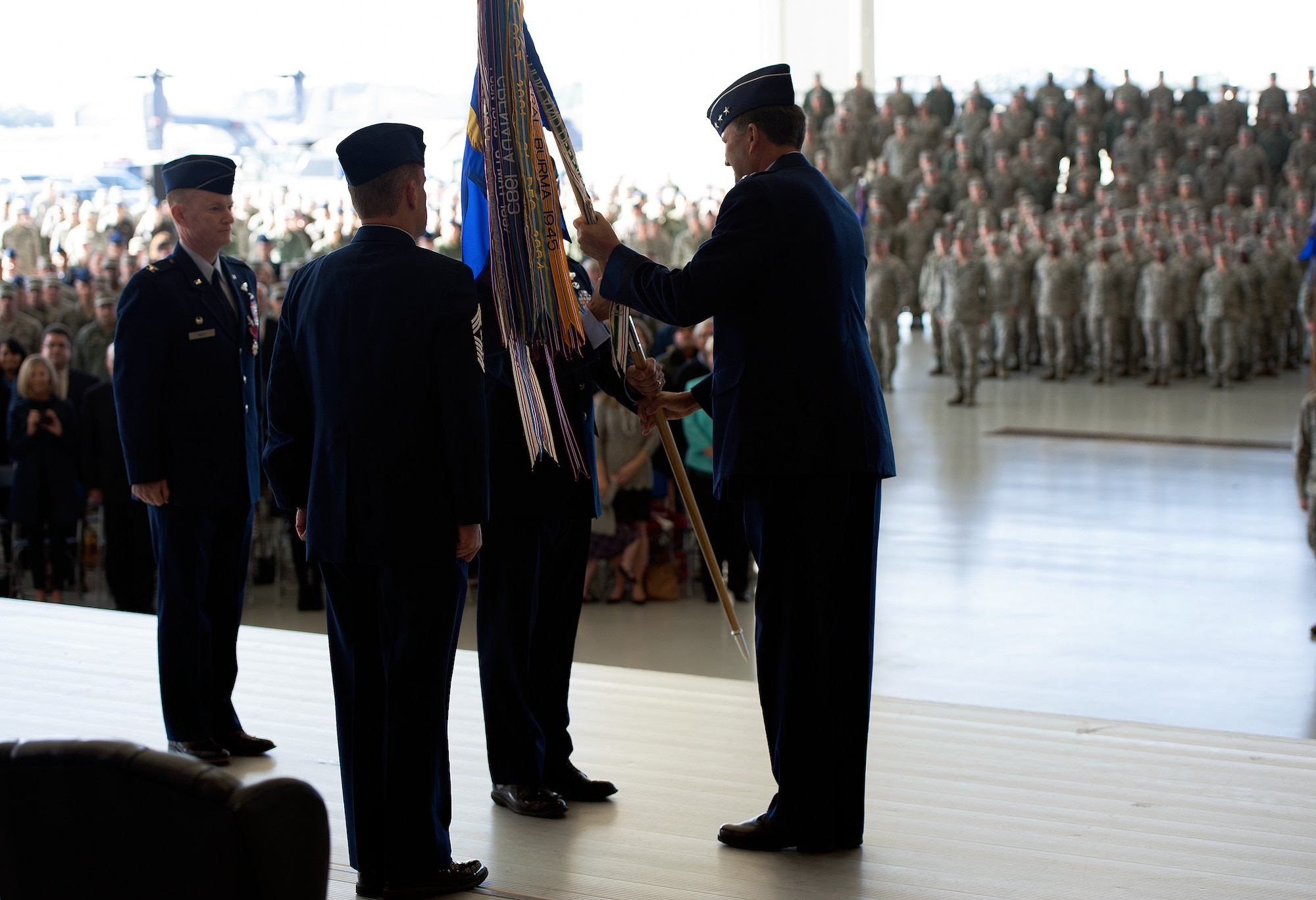 Col. Sean Farrell assumes command of the 1st SOW from Lt. Gen. Bradley A. Heithold, Air Force Special Operations Command commander during a change of command ceremony here, Jan. 6, 2015. The primary mission of the 1st SOW is to rapidly plan and execute specialized and contingency operations in support of national priorities. (U.S. Air Force photo/Staff Sgt. Kentavist P. Brackin)