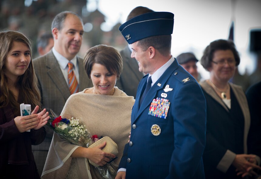 Col. Sean Farrell, 1st Special Operations Wing commander, and family exit the 1st Special Operations Wing change of command ceremony at the Freedom Hangar on Hurlburt Field, Fla., Jan. 6, 2015. Col. Sean Farrell assumed command of the 1st Special Operations Wing. (U.S. Air Force photo/Senior Airman Krystal M. Garrett) 