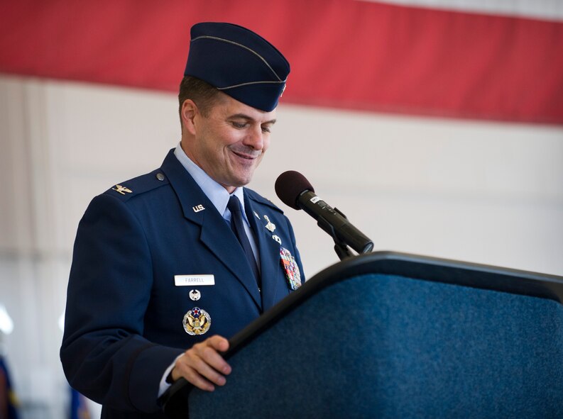Col. Sean Farrell speaks to members of the 1st Special Operations Wing after assuming command during the change of command ceremony at the Freedom Hangar on Hurlburt Field, Fla., Jan. 6, 2105. (U.S. Air Force photo/Senior Airman Krystal M. Garrett)