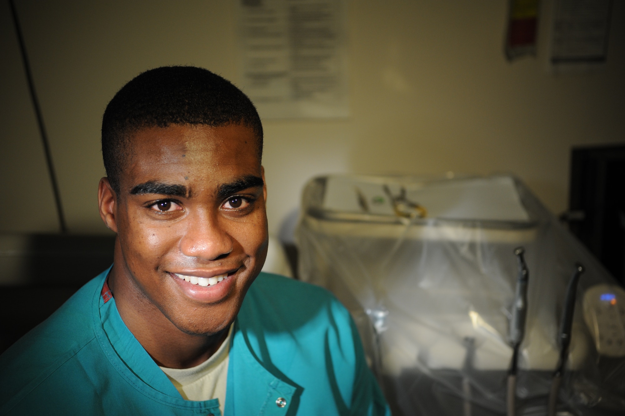 U.S. Air Force Airman 1st Class Christopher Walker, 35th Dental Squadron dental assistant, sits in front of a tray of dental tools at his work station at Misawa Air Base, Japan, Dec. 2, 2014. Walker assists in stocking and organizing supplies for dentists and other dental assistants. (U.S. Air Force photo by Airman 1st Class Jordyn Rucker/Released)