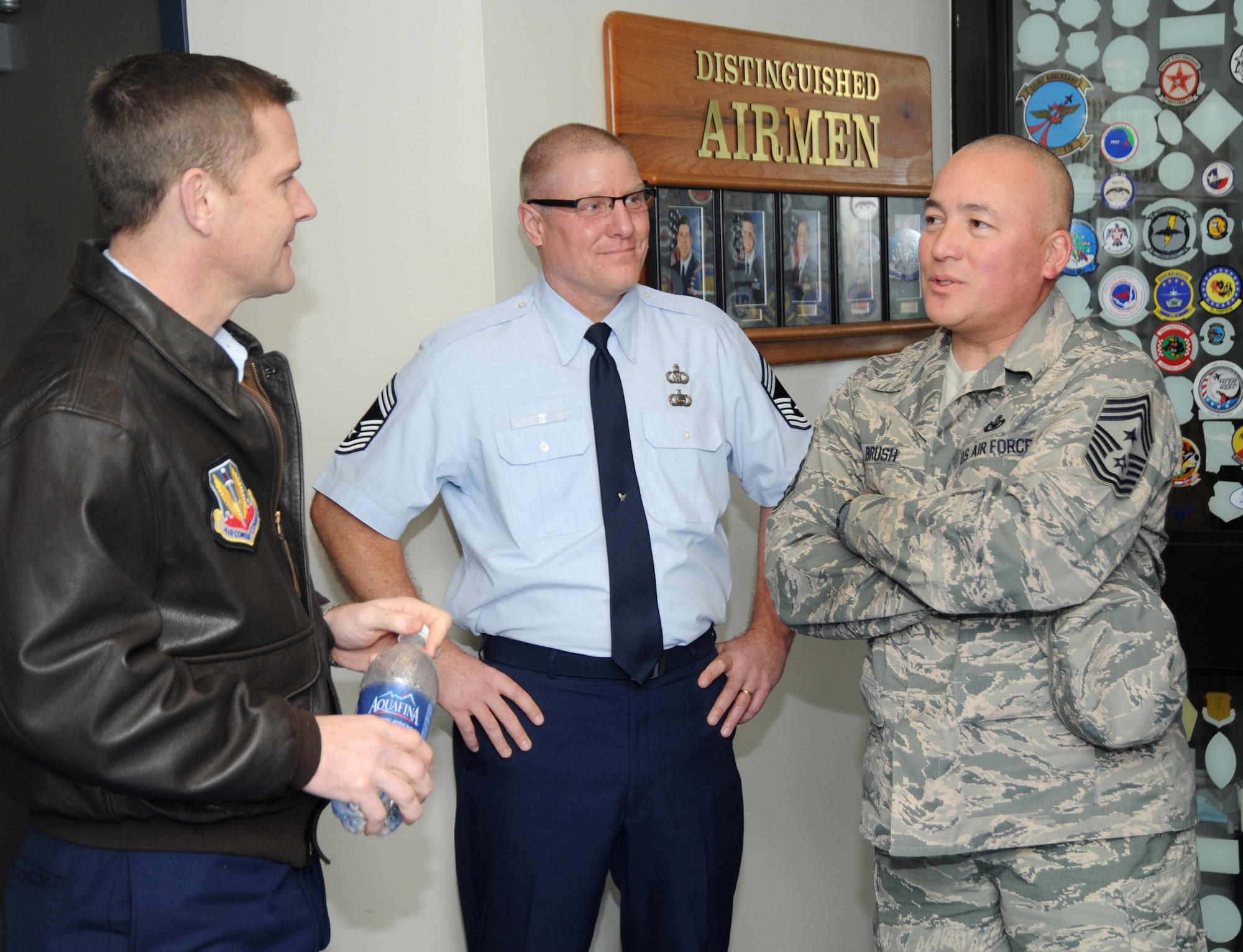 Chief Master Sgt. Mitchell O. Brush, Senior Enlisted Advisor for the National Guard Bureau, right, is greeted by Col. Rick Wedan, 142nd Fighter Wing commander, left, and Chief Master Sgt. David Fry, command post superintendent, assigned to the 142nd Fighter Wing, center, Portland, Ore., Jan. 5, 2015. Chief Brush toured the air base and led a town hall event to highlight the changes and challenges that Soldiers and Airmen of the National Guard face going into the New Year. (U.S. Air National Guard photo by Tech. Sgt. John Hughel, 142nd Fighter Wing Public Affairs/Released)