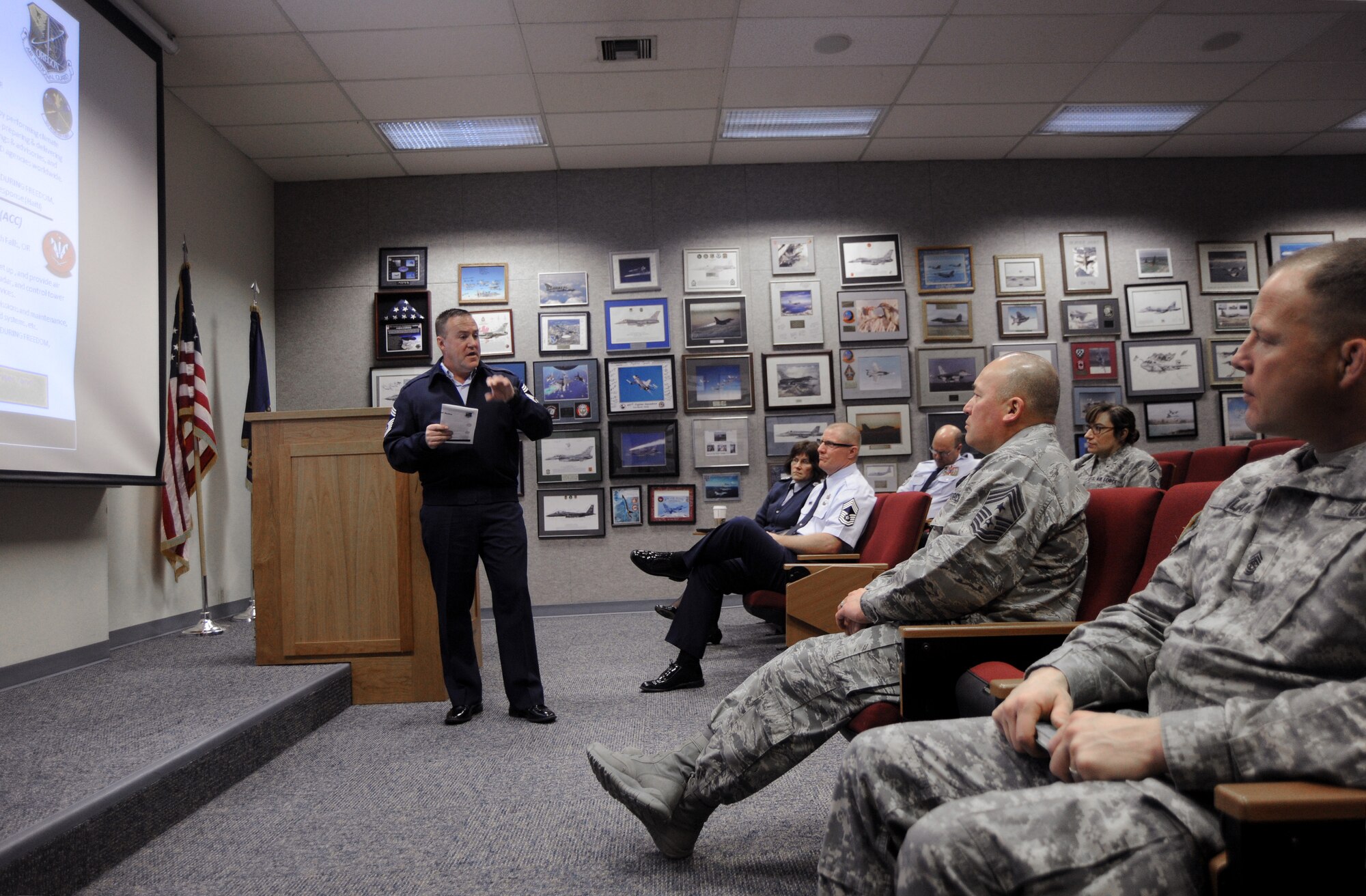 Chief Master Sgt. Christopher Roper, Senior Enlisted Advisor for the Oregon Air National Guard Combat Operations Group (COG), left, gives a brief and overview of the COG mission to Chief Master Sgt. Mitchell O. Brush, Senior Enlisted Advisor for the National Guard Bureau and SGM Shane Lake, Oregon National Guard Senior Enlisted Advisor at the Portland Air National Guard Base, Ore., Jan. 5, 2015. (U.S. Air National Guard photo by Tech. Sgt. John Hughel, 142nd Fighter Wing Public Affairs/Released)