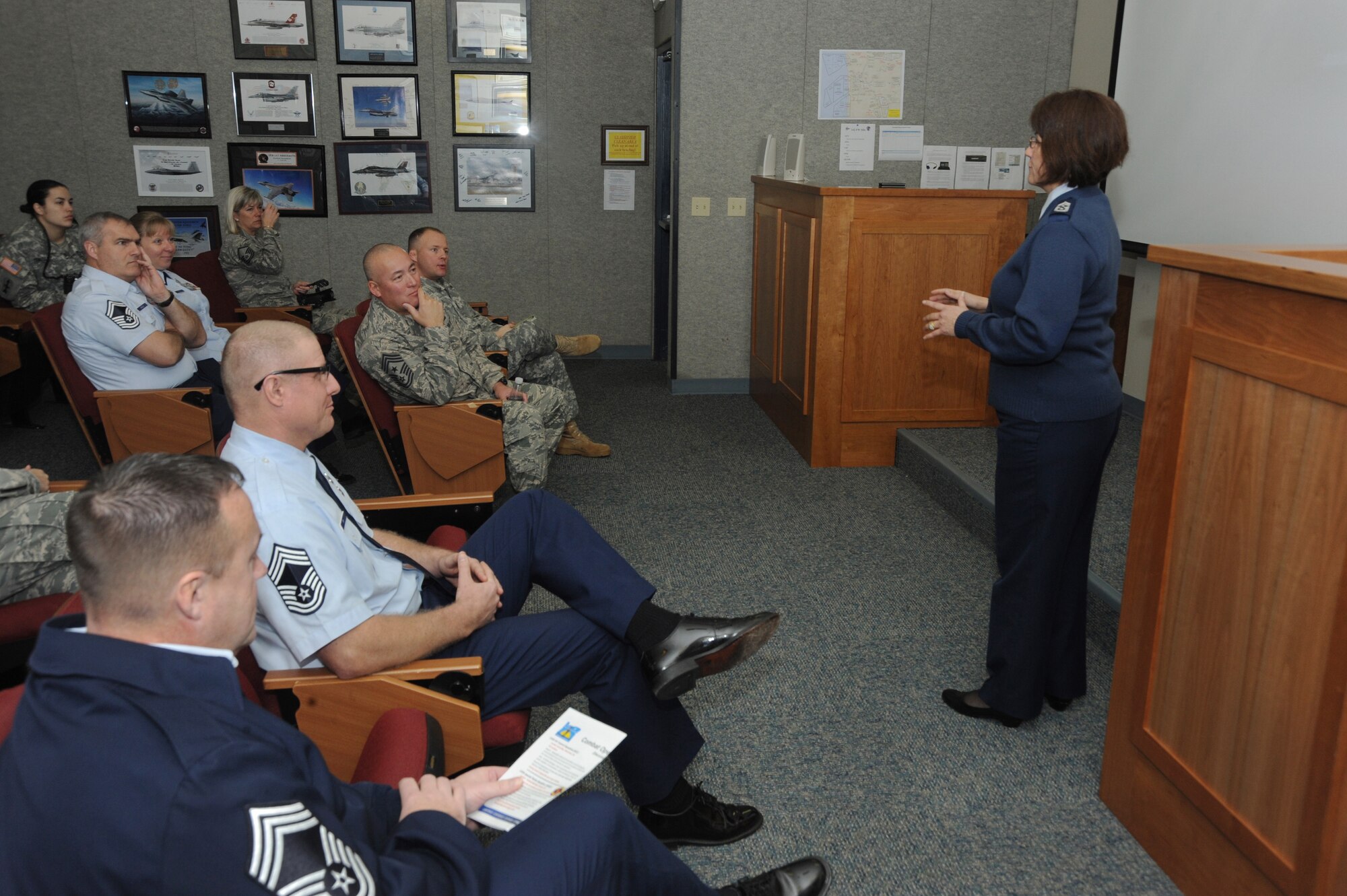 Chief Master Sgt. Julie Eddings, 142nd Fighter Wing Command Chief, right, gives a brief overview of the 142nd Fighter Wing mission to Chief Master Sgt. Mitchell O. Brush, Senior Enlisted Advisor for the National Guard Bureau, during his tour of the Portland Air National Guard Base, Ore., Jan. 5, 2015. (U.S. Air National Guard photo by Tech. Sgt. John Hughel, 142nd Fighter Wing Public Affairs/Released)