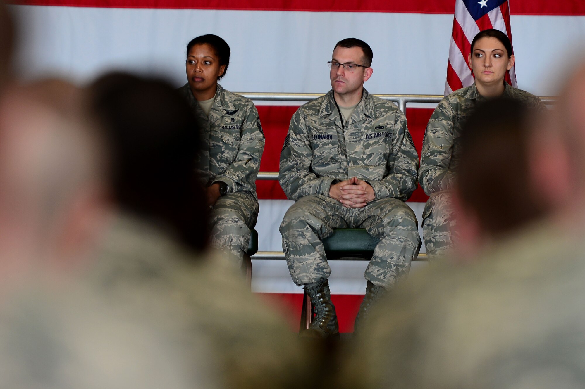 Members of Team Shaw listen during an all-call held by U.S. Air Force Col. Stephen Jost, 20th Fighter Wing commander, at Shaw Air Force Base, S.C., Jan. 5, 2015. Jost held the all-call to introduce his new initiative “Airman Up,”; a program which challenges Airman to focus on resiliency and personal development. (U.S. Air Force photo by Airman 1st Class Michael Cossaboom/Released)