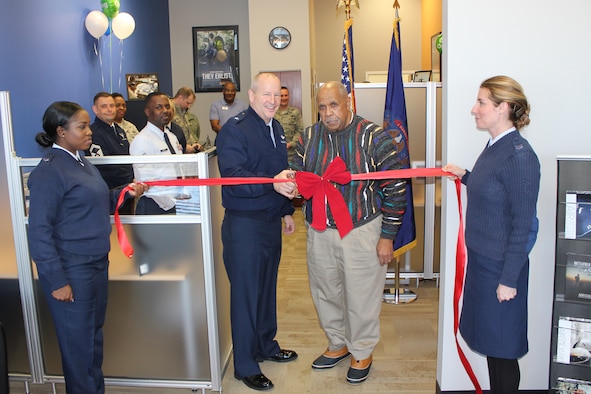 Brig. Gen. John D. Slocum, 127th Wing commander, and Myron Frasier, a member of the Southfield, Mich., City Council, cut the ribbon to open a new Air National Guard recruiting office in Southfield, Jan. 6. 2015. Holding the ribbon are Tech. Sgt. Daquita Hamilton and Tech. Sgt. Maygan Rhodes, both recruiters with the 127th Wing, which is based at Selfridge Air National Guard Base, Mich. (U.S. Air National Guard photo by Tech. Sgt. Dan Heaton