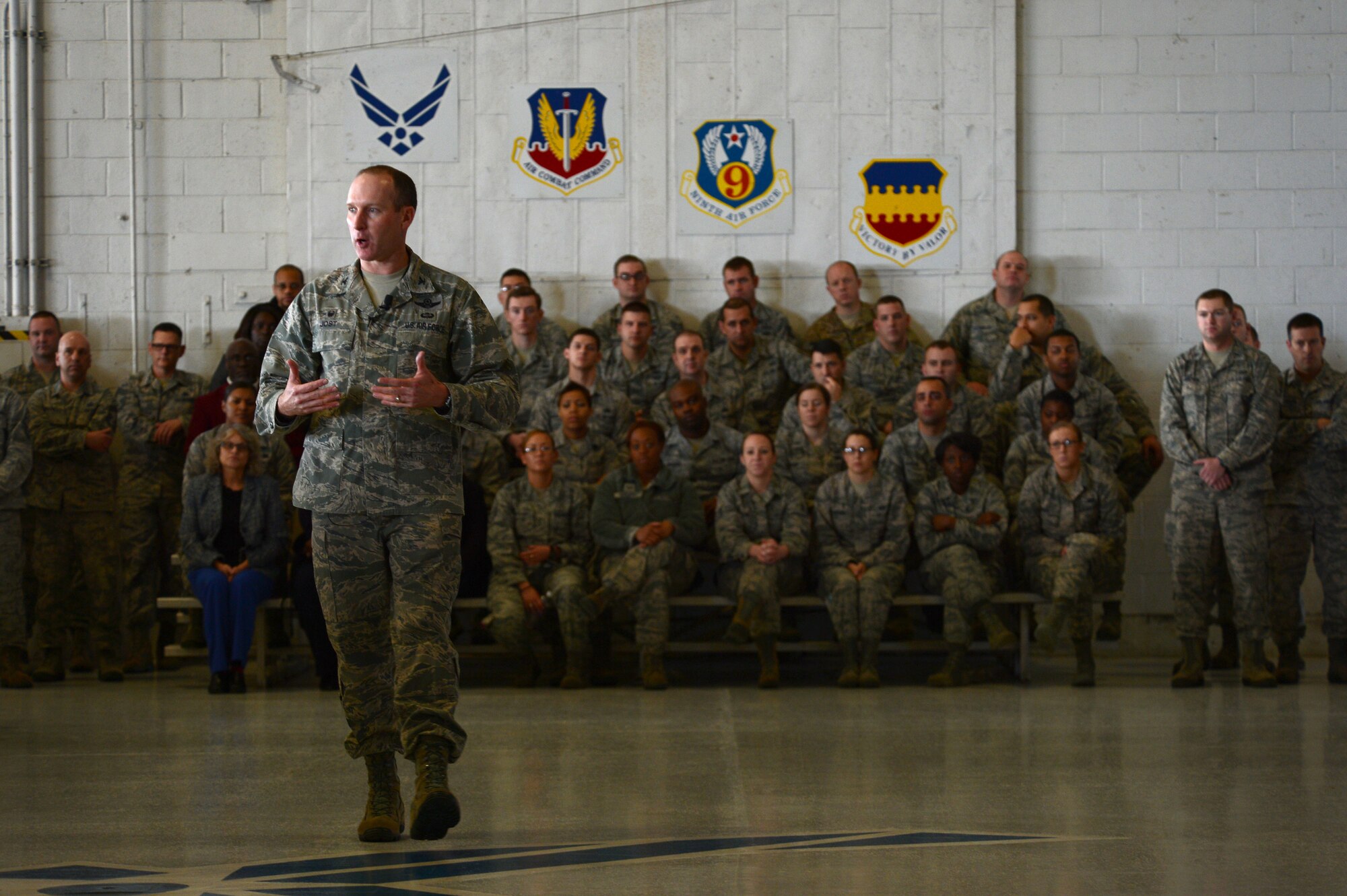 U.S. Air Force Col. Stephen Jost, 20th Fighter Wing commander, speaks to 20th FW members during an all-call at Shaw Air Force Base, S.C., Jan. 6, 2015. Jost unveiled his new initiative “Airman Up”, a challenge for Airmen to become more resilient and improve themselves on and off duty. (U.S. Air Force photo by Senior Airman Jensen Stidham/Released) 