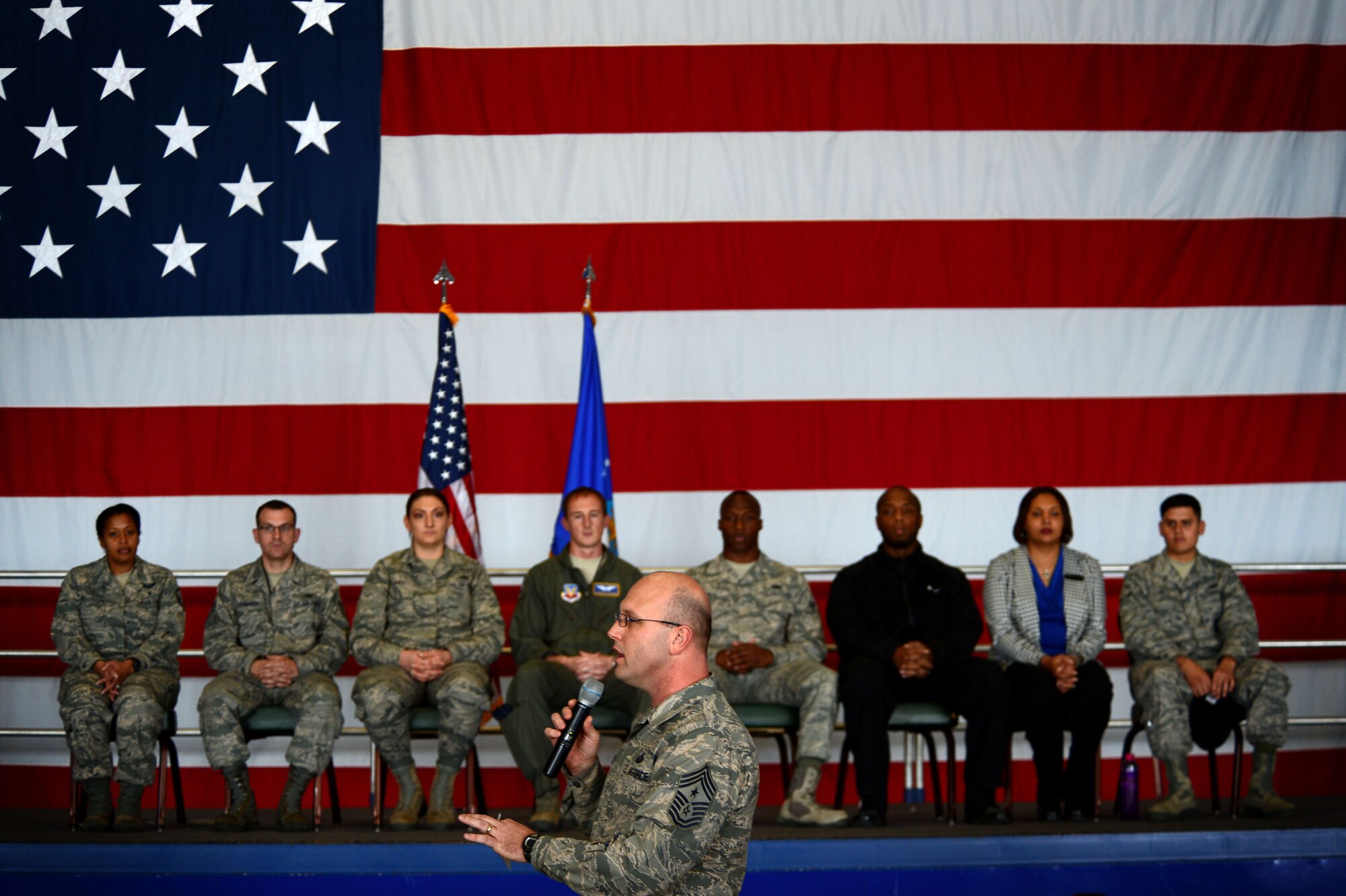 U.S. Air Force Chief Master Sgt. Charles Mills, 20th Fighter Wing command chief, speaks to Airmen during an all-call at Shaw Air Force Base, S.C., Jan. 6, 2015. Mills told the hundreds of attendees how proud he was of the 20th FW for meeting the challenges faced in the previous year. (U.S. Air Force photo by Senior Airman Jensen Stidham/Released)   
