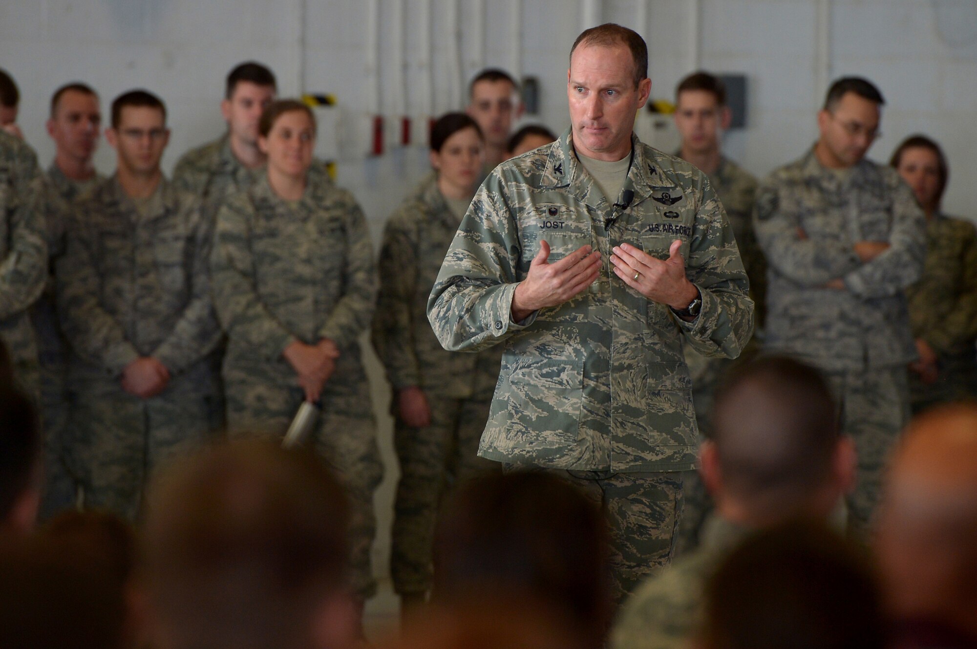 U.S. Air Force Col. Stephen Jost, 20th Fighter Wing commander, speaks to 20th FW Airmen during an all-call, at Shaw Air Force Base, S.C., Jan. 5, 2015. Jost unveiled a new initiative called “Airman Up,” encouraging all Airmen to continue being outstanding while striving for greater achievements in all aspects of their lives on-and off-duty. (U.S. Air Force photo by Staff Sgt. Kenny Holston/Released)