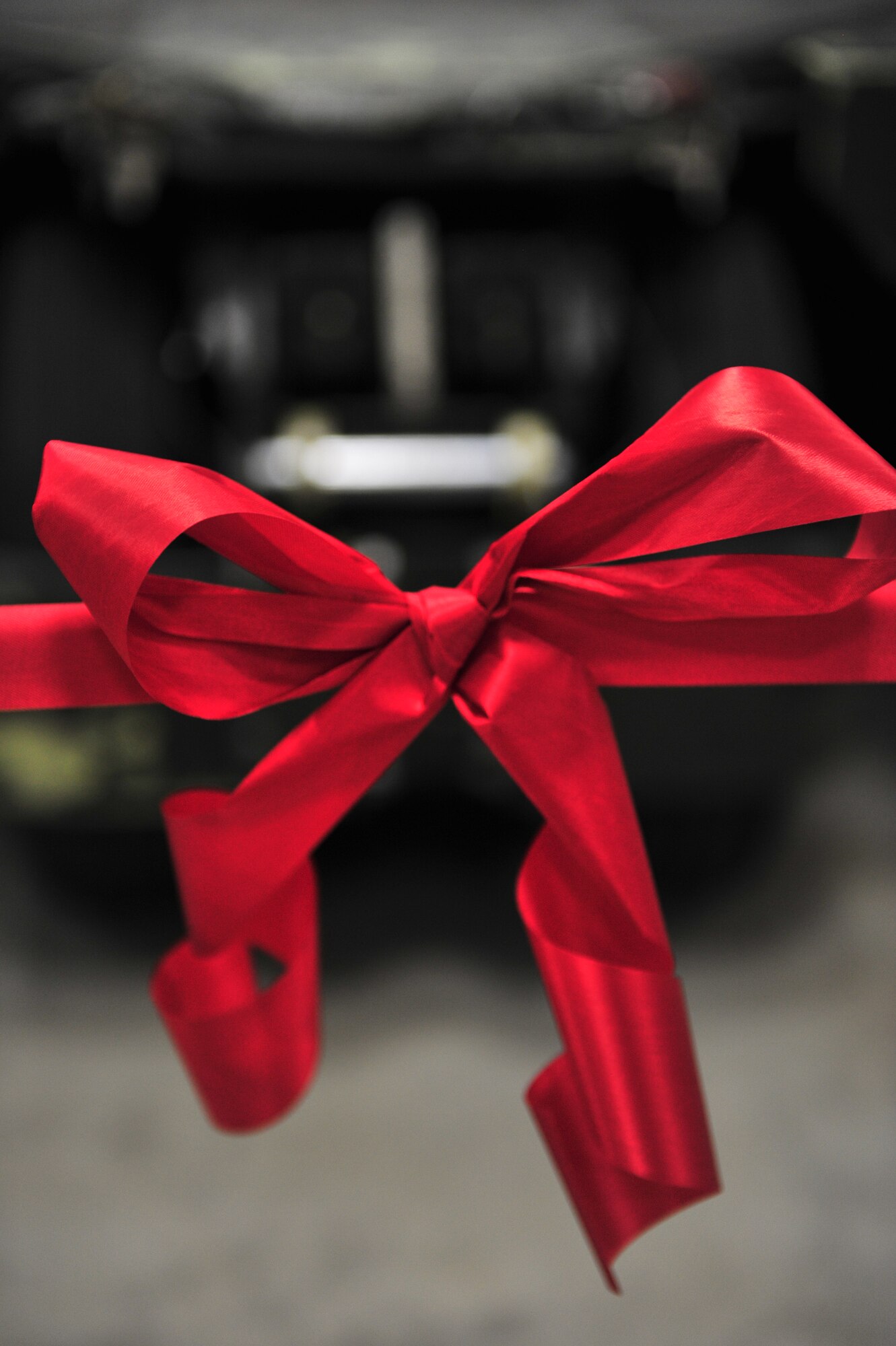 A ribbon remains stretched at a Ribbon Cutting Ceremony on Minot Air Force Base, N.D., Dec. 12, 2014. Construction began on the new Aerospace Ground Equipment flight’s munition handling trailer maintenance facility in November 2013 to increase the bay’s capacity. (U.S. Air Force photo/Senior Airman Malia Jenkins) 