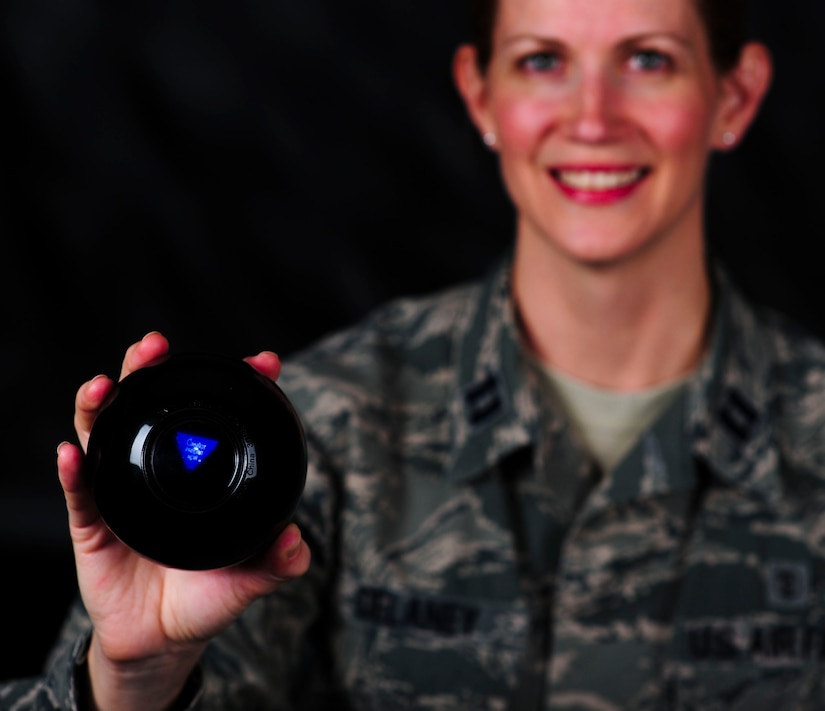 U.S. Air Force Capt. Nancy DeLaney, 633rd Medical Operations Squadron psychologist, often consults her magic 8-ball on issues she faces in life to lift her spirits and regroup. DeLaney said just like the 8-ball, life can sometimes give answers no one wants to hear. In the Air Force, however, DeLaney believes there is ample opportunity for someone to find help when those answers pop up. (U.S. Air Force photo by Senior Airman Austin Harvill/Released)