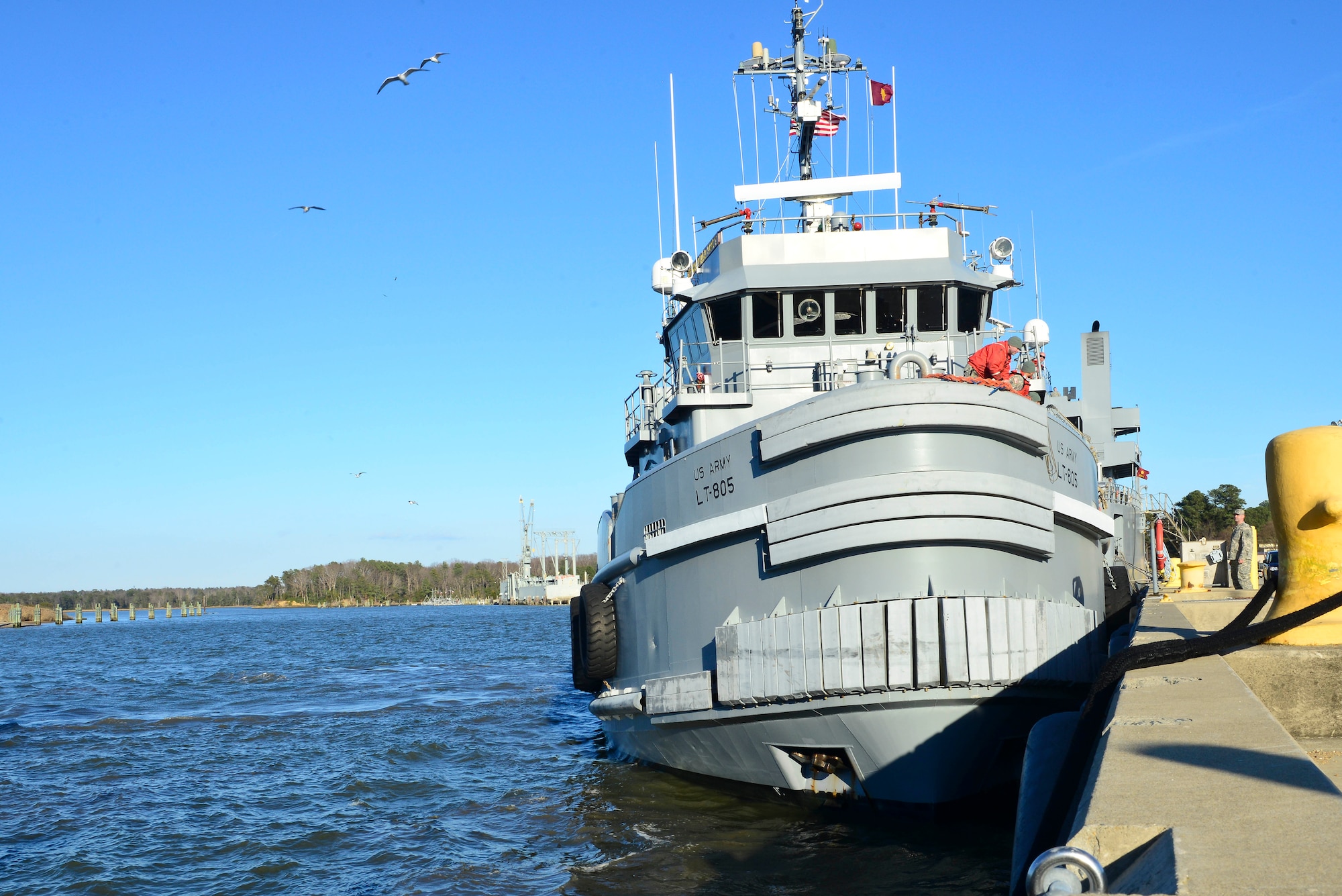 A large ocean-going tug returns to Third Port at Fort Eustis, Va., Jan. 5, 2015, after being displaced for two years. With the boat back at Fort Eustis, Soldiers assigned to it will no longer need to travel to the U.S. Coast Guard Training Center, Yorktown Pier to use the tug. (U.S. Air Force photo by Senior Airman Kimberly Nagle/Released) 