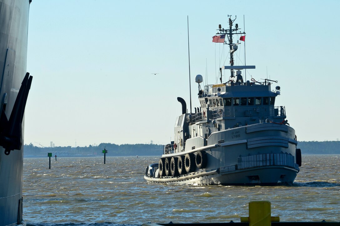 A large ocean-going tug boat assigned to the 7th Transportation Brigade (Expeditionary) returns to Third Port at Fort Eustis, Va., Jan. 5, 2015, after being displaced for two years. The boat was allowed to return after a month-long dredging process was recently completed at Third Port, clearing the waters of build up sediments. (U.S. Air Force photo by Senior Airman Kimberly Nagle/Released)