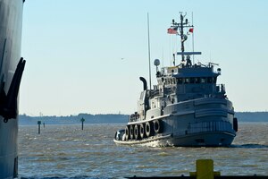 A large ocean-going tug boat assigned to the 7th Transportation Brigade (Expeditionary) returns to Third Port at Fort Eustis, Va., Jan. 5, 2015, after being displaced for two years. The boat was allowed to return after a month-long dredging process was recently completed at Third Port, clearing the waters of build up sediments. (U.S. Air Force photo by Senior Airman Kimberly Nagle/Released)