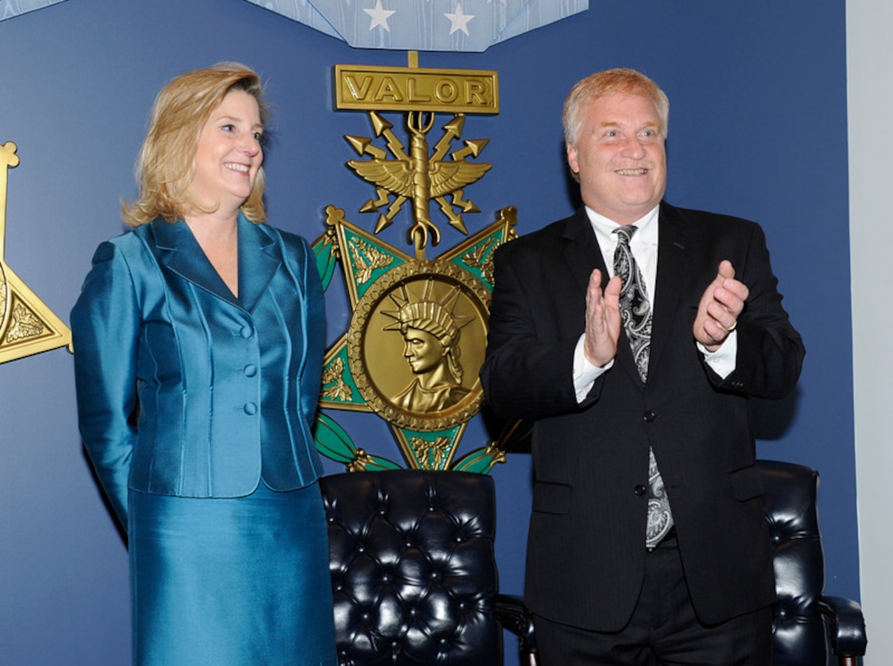 Christine E. Wormuth, under secretary of defense for policy, stands with J. Alan Liotta during his Pentagon Hall of Heroes retirement ceremony Jan. 5, 2015. Liotta retired after 32 years of federal service, and served as DoD’s principal director of detainee affairs. Photo by Darrell Hudson