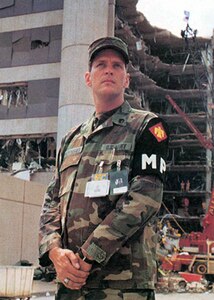 Army Staff Sgt. David Humphries of the 745th Military Police Company, Oklahoma National Guard, stands watch while rescue operations at the Alfred P. Murrah Federal Building continue April 20, 1995, the day after the Oklahoma City bombing.