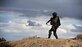 Staff Sgt. Dontea White scans the area around his convoy for simulated explosive ordnance devices during the dismounted operations portion of the course Dec. 17, 2014, at the Silver Flag Alpha Range Complex, Nev. White is a Base Security Operations course student training for his first deployment and is currently assigned to the 512th Security Forces Squadron at Dover Air Force Base, Delaware. (U.S. Air force photo/Tech. Sgt. Nadine Barclay)