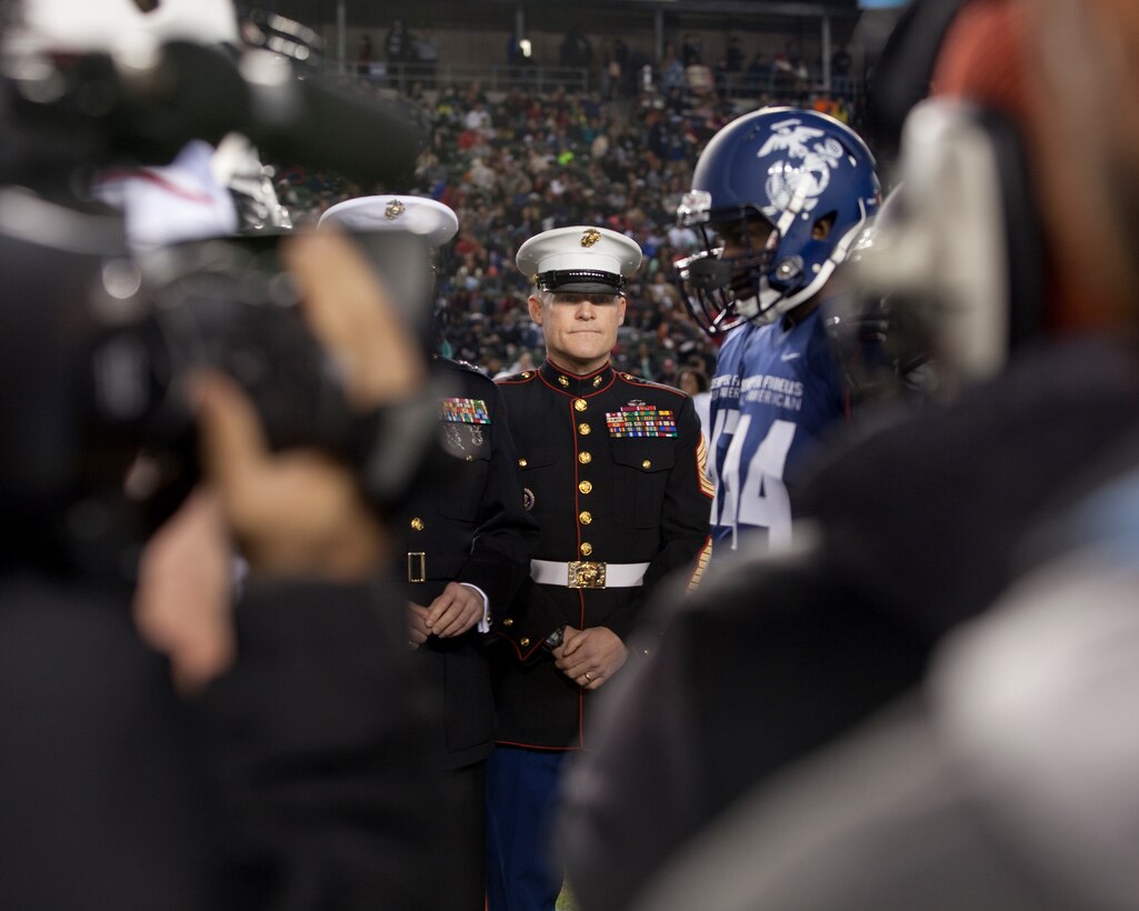 Sgt. Maj. Micheal P. Barrett, the 17th Sergeant Major of the Marine Corps, stands on the football field during the coin toss before the 2015 Semper Fidelis All-American Bowl, at the StubHub Center, Carson, Calif., on Jan. 4, 2015. (U.S. Marine Corps photo by Lance Cpl. Samantha K. Draughon/ Released)