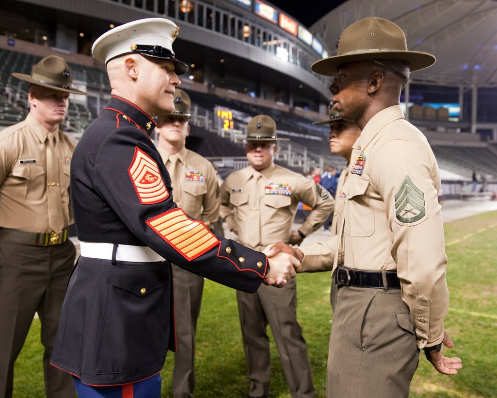Sgt. Maj. Micheal P. Barrett, the 17th Sergeant Major of the Marine Corps, speaks with Drill Instructors at the 2015 Semper Fidelis All-American Bowl, at the StubHub Center, Carson, Calif., on  Jan. 4, 2015. (U.S. Marine Corps photo by Lance Cpl. Samantha K. Draughon/ Released)