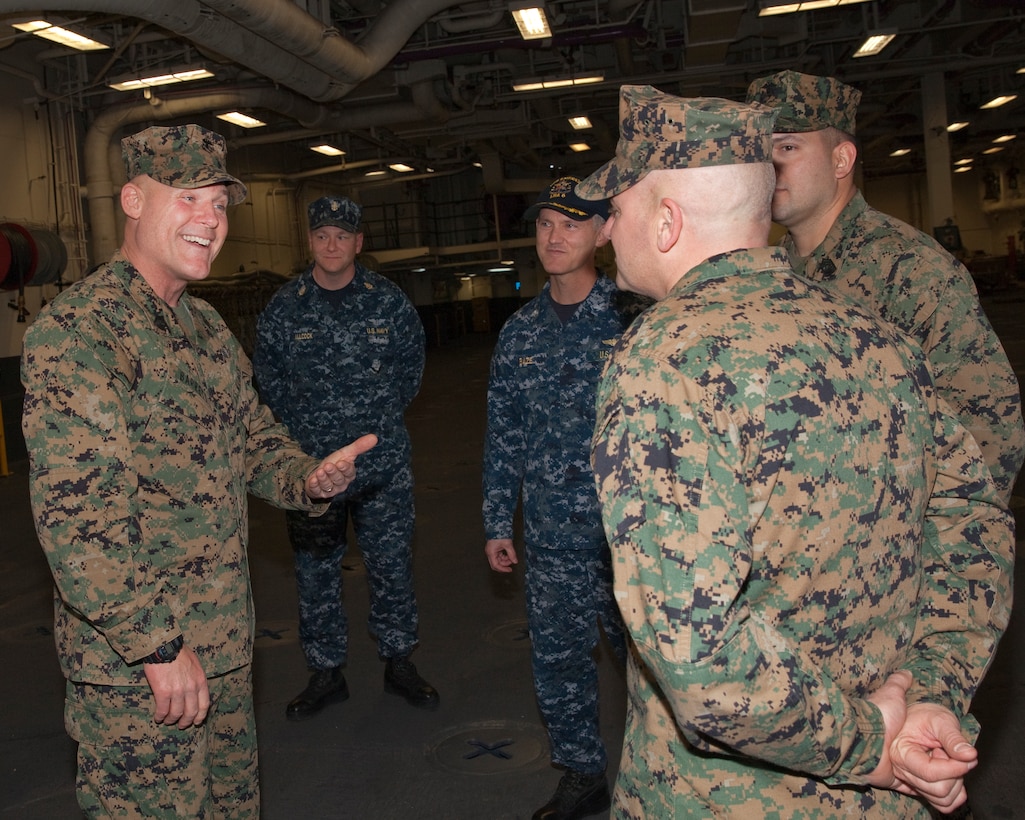 Sgt. Maj. Micheal P. Barrett, the 17th Sergeant Major of the Marine Corps, greets Marines and Sailors aboard the USS America (LHA-6), at Naval Base San Diego, Calif., on Jan. 5, 2015. (U.S. Marine Corps photo by Lance Cpl. Samantha K. Draughon/ Released)