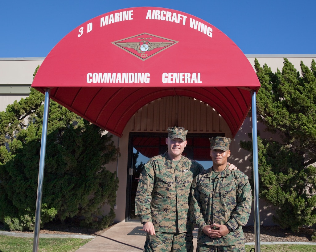 Sgt. Maj. Micheal P. Barrett, the 17th Sergeant Major of the Marine Corps, stands with a Marine on Marine Corps Air Station Miramar, Calif., on Jan. 5, 2015. (U.S. Marine Corps photo by Lance Cpl. Samantha K. Draughon/ Released)