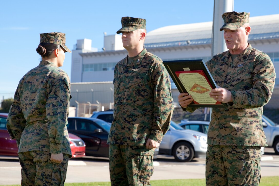 Sgt. Maj. Micheal P. Barrett, the 17th Sergeant Major of the Marine Corps, reads the promotion warrant at Staff Sgt. Keonaona Paulo-Munoz's promotion ceremony at Marine Corps Air Station Miramar, Calif., on Jan. 5, 2015. (U.S. Marine Corps photo by Lance Cpl. Samantha K. Draughon/ Released)