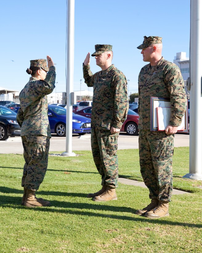 Sgt. Maj. Micheal P. Barrett, the 17th Sergeant Major of the Marine Corps, reads the promotion warrant at Staff Sgt. Keonaona Paulo-Munoz's promotion ceremony at Marine Corps Air Station Miramar, Calif., on Jan. 5, 2015. (U.S. Marine Corps photo by Lance Cpl. Samantha K. Draughon/ Released)