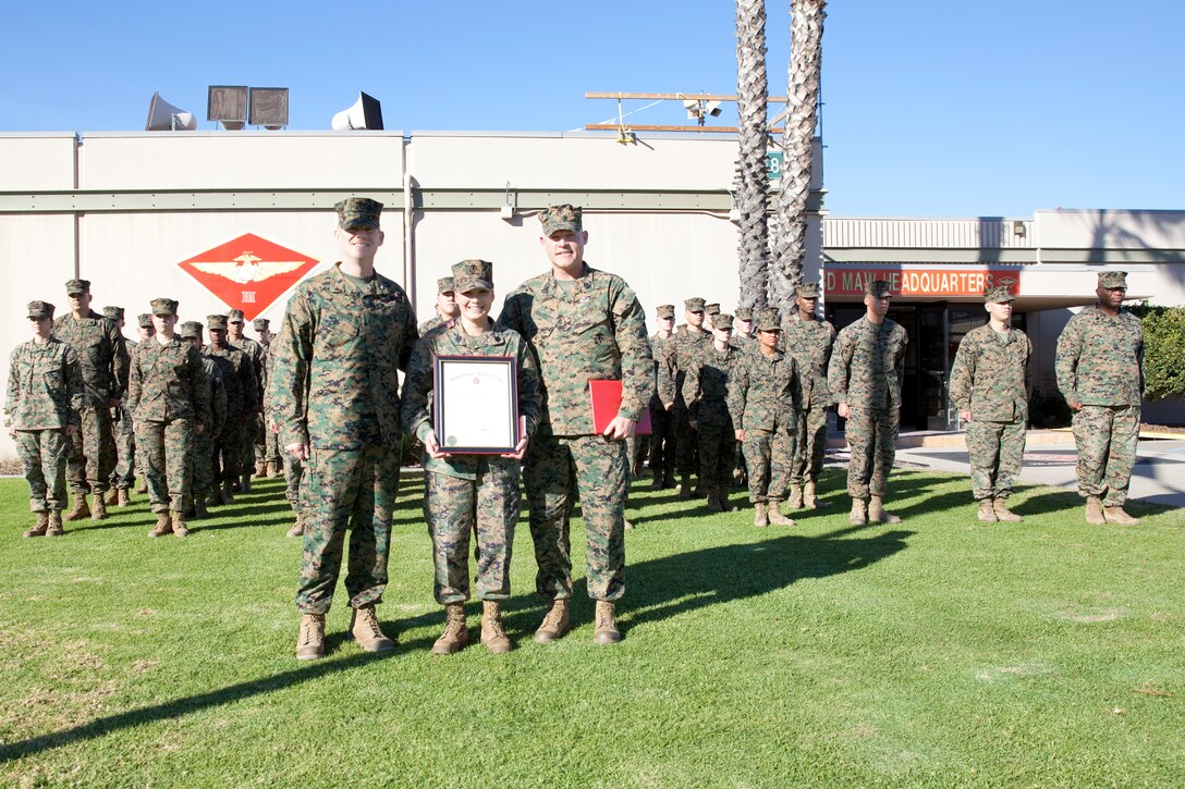 Sgt. Maj. Micheal P. Barrett, the 17th Sergeant Major of the Marine Corps, congratulates Staff Sgt. Keonaona Paulo-Munoz at her promotion ceremony at Marine Corps Air Station Miramar, Calif., on Jan. 5, 2015. (U.S. Marine Corps photo by Lance Cpl. Samantha K. Draughon/ Released)
