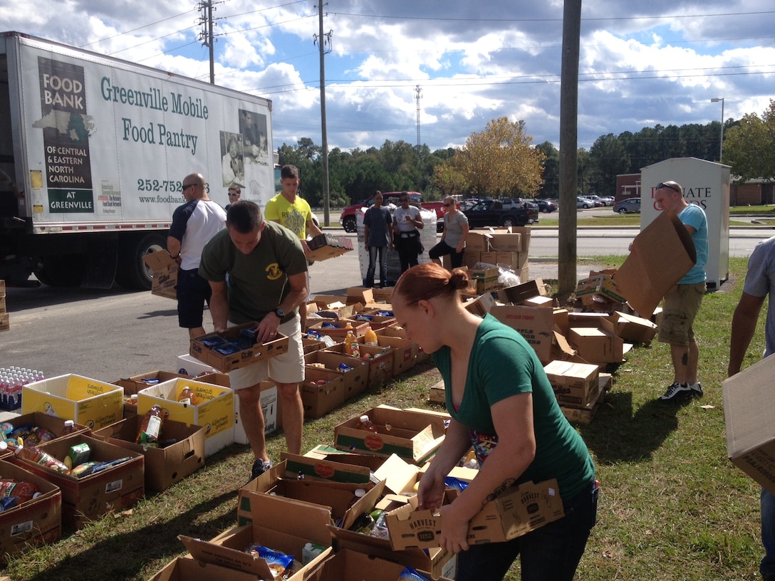 Marines and sailors with 8th Communication Battalion, II Marine Headquarters Group volunteered for the local Salvation Army food drive in Jacksonville, N.C., Oct. 17.  All of the food was donated by local distributors.