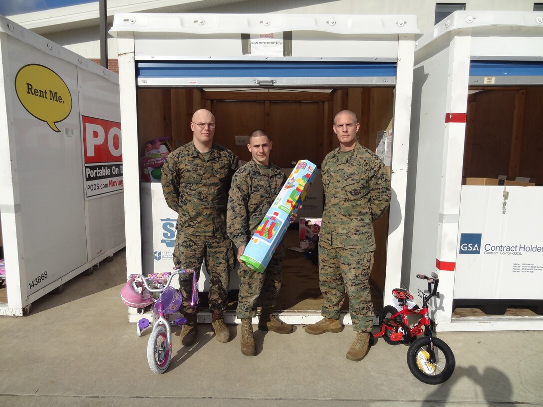 Marines and sailors with 8th Communication Battalion, II Marine Headquarters Group collected over 1,100 toys for the 2014 Eastern North Carolina Toys for Tots drive. The donated toys were delivered to the local coordinator for distribution, Dec. 10.