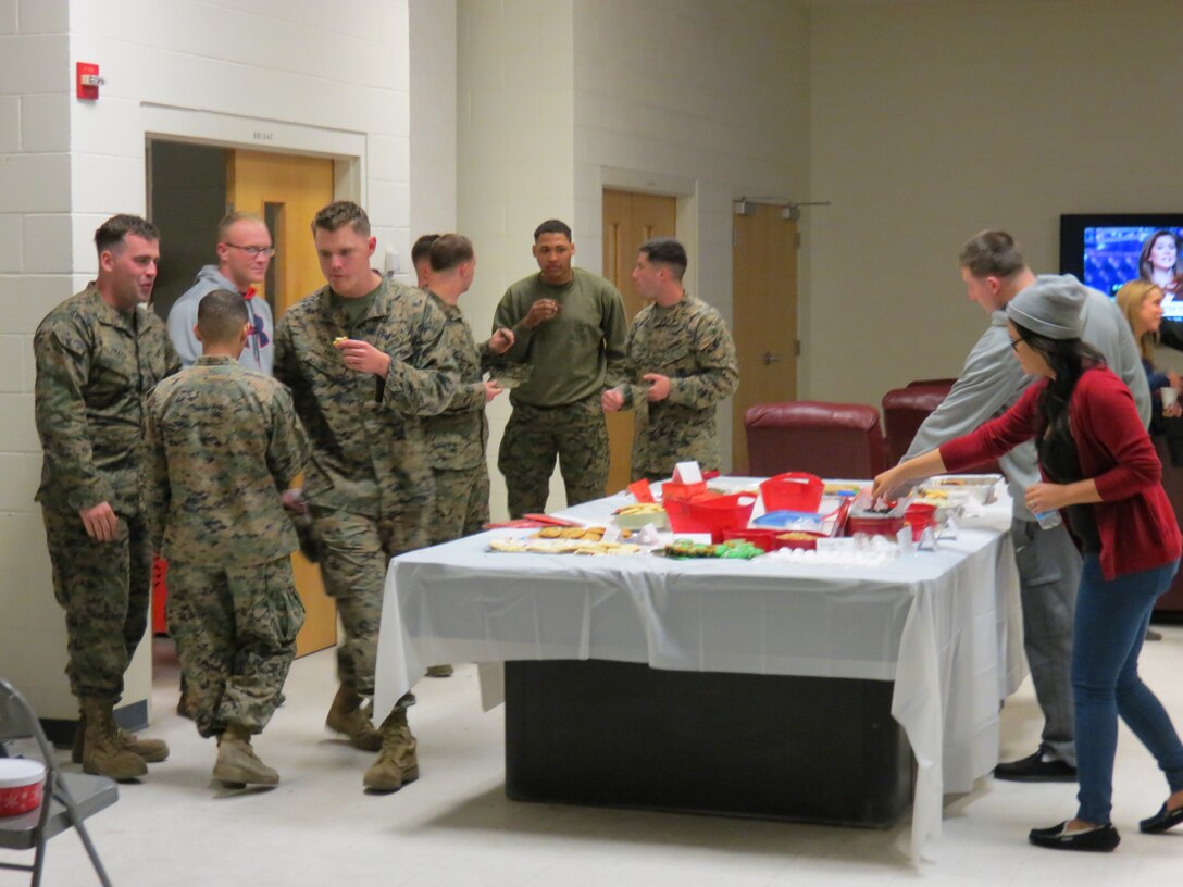 Spouses of 8th Communication Battalion service members organized and held a cookie exchange for the service members living in the barracks aboard Marine Corps Base Camp Lejeune, N.C., Dec. 11.