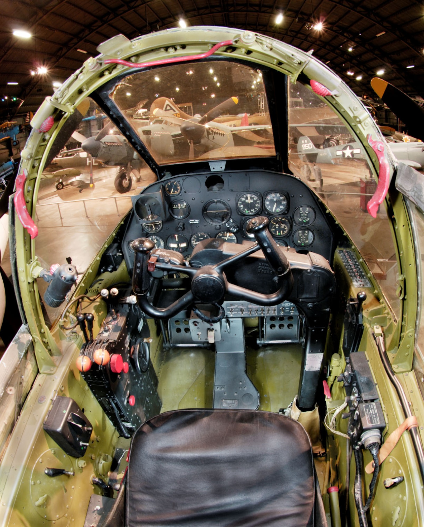 Pilot’s view of the cockpit of a Lockheed P-38L Lightning, a view that grew familiar to pilot trainees in the 432nd Army Air Force Base Unit (Combat Crew Training Station-Fighter) during their training on the P-38 at Portland, Redmond and Madras, Oregon, during World War II.  This aircraft is at the National Museum of the USAF at Wright Patterson AFB, Ohio. (National Museum of the Air Force)